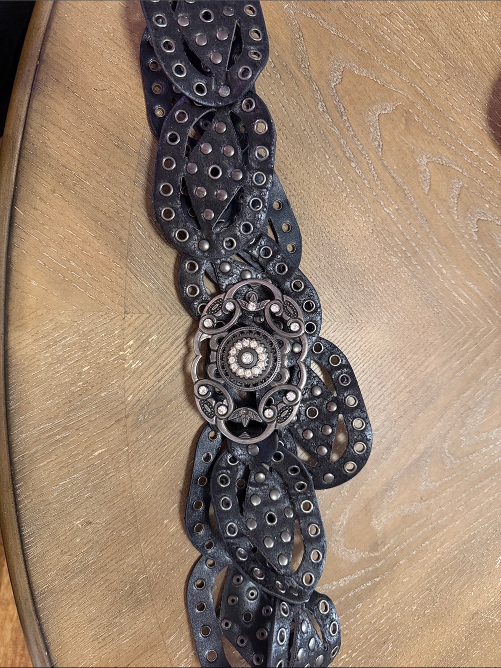 Black Leather Decorative Belt with Ornate Silver-Tone Concho